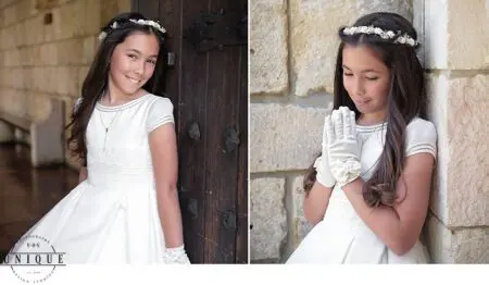 Young girl in white communion dress and flower crown.