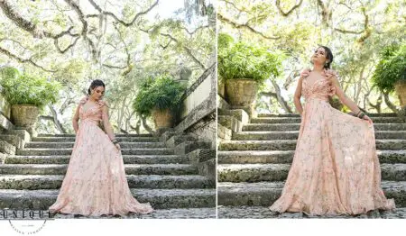 Woman in floral dress on stone steps.