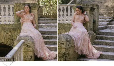 Woman in floral dress on stone steps.