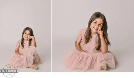 Smiling girl in pink tulle dress.