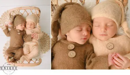 Twin babies sleeping in knitted outfits.