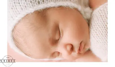 Closeup of sleeping newborn baby's face.