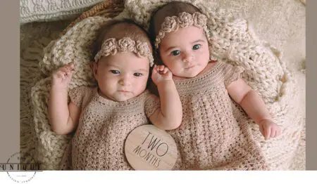 Twin baby girls in crocheted dresses at two months old.