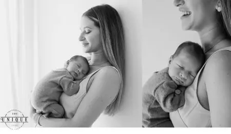 A woman holding a sleeping newborn.