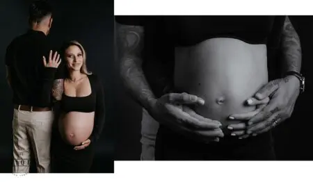 Pregnant woman and partner pose for photo.