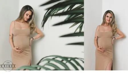 Pregnant woman in a brown dress with palm leaves.
