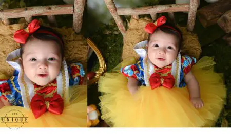 Baby girl dressed as Snow White.