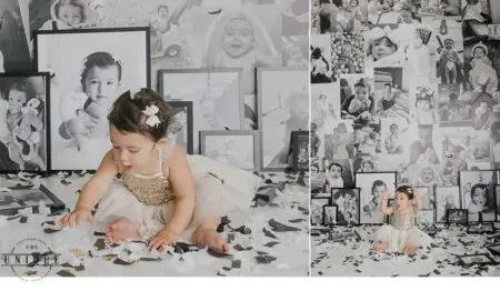 Baby girl playing with confetti near framed photos.