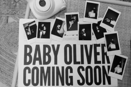 Black and white baby announcement with photos.